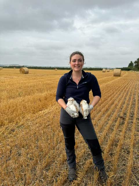 Laura with a pair of owls
